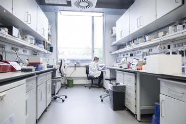 woman working in a chemical lab. MHA Consulting Leads BIA for Global Chemical Firm