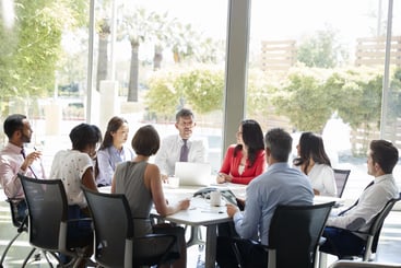 A diverse group of professionals engaged in a business meeting