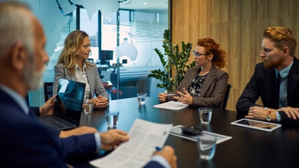 group of business people discussing in meeting